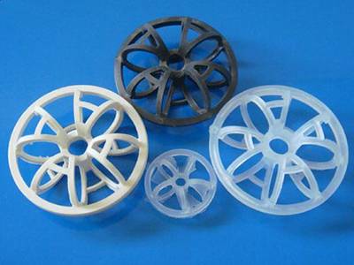 There are four plastic teller rosettes in different sizes and colors.