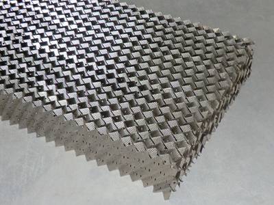 This is a piece of metal perforated plate corrugated packing in rectangle shape.