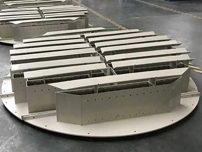 There is a two-stage trough liquid distributor placed on the ground.